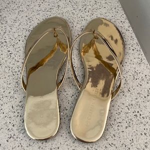 Gold flip flops